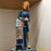 The Flight Attendant <br> (L 16 x H 44) cm
