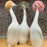 Goossiping Geese Figurine <br> 
Orange and Green <br>
(L 8 x W 11 x H 21) cm